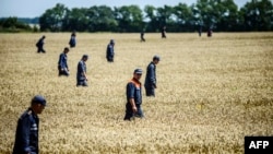 Год таму разьбіўся малайзійскі Боінг ФОТАГАЛЕРЭЯ