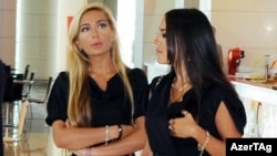 Azerbaijani President Ilham Aliyev's daughters, Arzu (left) and Leyla, at Park Bulvar in Baku (file photo)