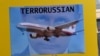 Плакат участника акции в Сиднее против союза России с террористами на востоке Украины